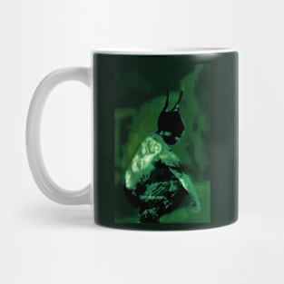 Portrait, digital collage and special processing. Horned devil is sitting. Like drawn. Green. Mug